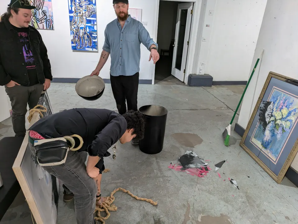 Art department at work among paintings and props